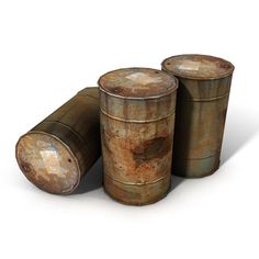 three old rusty tin canisters sitting next to each other