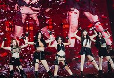 girls'generation performing on stage with confetti falling in the air behind them