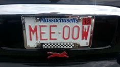 a license plate that says mee oow on the back of a black car