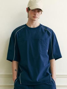 This is a casual and comfortable t-shirt that is made out of high quality nylon and spandex blend fabric. With design detail of color contrasting piping detail overall and minimal logo embroidery on the chest pocket, it gives a trendy and refined look. - Semi oversized silhouette- Chest patch pocket with logo embroidery- Adjustable string and stopper on the hem- Piping detail Mens Shirt Illustration, Navy Sporty Top With Pockets, Mens Street Wear, Color Block Tshirt, Minimal Embroidery, Model Illustration, Sportswear Details, Minimal Shirt Design, Sports Wear Fashion