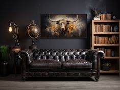 a living room with a leather couch and bookshelf