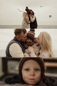 two adults and one child are standing on the beach with seagulls in the background