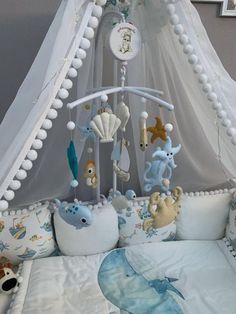 a baby crib with stuffed animals on it