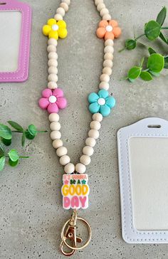 a keychain that has some beads on it and a tag attached to it