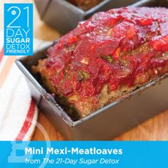 two boxes of meatloaf sitting on top of a wooden table