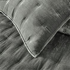 a black and white photo of a bed with two pillows