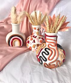 "Hand-decorated 5\" ceramic statement vases. I have many different styles and options on my shop if you'd like to see more. Neutral boho style squiggles, rainbows, abstract faces, vines, terrazzo, and other styles. These vases are an ideal home accent for a desert or moroccan style boho or modern home. Their neutral colors blend well with nearly any home environment, and look great with some flowers, stems, or plants. This ceramic vase brings retro eclectic boho style to any space. | 5\" Tall Re Cute Ceramic Vase, Vase Cute, Modern Ceramic Vase, Retro Eclectic, Statement Vase, Boho Vase, Large Ceramic Vase, Handmade Ceramics Vase, Art Decor Diy