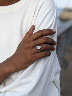 a close up of a person wearing a ring