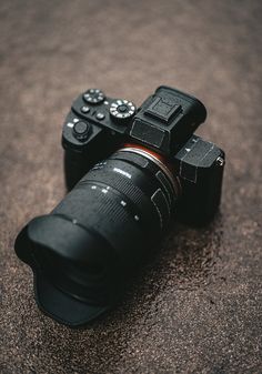 a camera sitting on the ground with its lens up