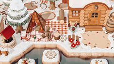 an image of a christmas scene with gingerbreads and other items in the snow