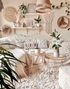 a living room filled with furniture and lots of plants on top of the wall next to a bed