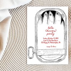 a card with an image of five fish in a boat and the words letters dinner party on it