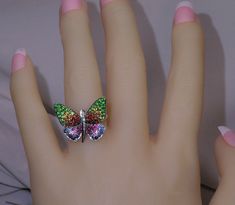 "IMPORTANT...CLICK ON DETAILS OR DESCRIPTION TO SEE ALL SPECS JEWELRY STORE RETAIL....$3,597.00 THIS GIRL IS MORE STUNNING IN PERSON-18K FEMININE COLORFUL BUTTERFLY RING. As with many pretty butterflies, this girl has SUPER colorful wings with intense shaded colors consisting of pink & blue, yellow & orange Sapphires, deep green Tsavorite Garnets, & rich rubies, with a body of sparkling white diamonds. She is white gold also white platinum rhodium plating over 18k gold for lasting be Multicolor Diamond Jewelry With Pave Setting, Multicolor Fine Jewelry For Party, Multicolor Rhinestone Jewelry For Anniversary, Multicolor Rhinestone Anniversary Jewelry, Fine Multicolor Jewelry With Diamond Accents, Gem Butterfly, Colorful Wings, Pretty Butterflies, Earrings White Gold