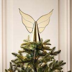 a christmas tree with angel wings on top