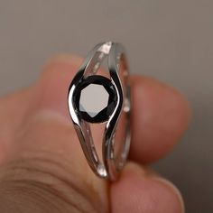 This is a gorgeous handmade creation. Its beauty is its simplicity & Elegance. The 7*7mm round shape faceted natural black spinel is crafted in solid sterling silver and with rhodium plated. All item is sent in a beautiful gift box If you have any idea of design your ring,pls contact me directly. You can realize more lovely stuff clicking the link https://www.etsy.com/shop/knightjewelry?refshopsection_shophome_leftnav Please leave the correct address and you phone number for delivering succe Black Birthstone Ring Gift, Black Spinel Sapphire Ring Gift, Black Sapphire Fine Jewelry Ring, Classic Black Sapphire Ring In Sterling Silver, Black Spinel Round Cut Rings, Elegant Black Sapphire Ring, Black Sapphire Fine Jewelry, Black Sapphire Ring For Formal Occasions, Modern Black Sapphire Ring