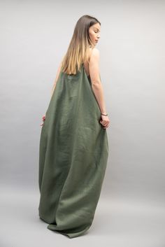 "Graceful, side draped with side hidden pockets, elegant and fancy, this dress is made of fine linen, it is easy to wear and perfect for formal events or casual occasions. Zero waste and high quality material, this garment brings comfort and a neat and stylish look. MATERIALS × linen 100% -------------------------------------------------- If you have any questions about the item or have any personal requirements about the garment, please do not hesitate to send us a message, our team is availabl Green Sundress Maxi For Daywear, Green Sundress Maxi Dress For Daywear, Satin Drape Dress, Drape Dresses, Green Kaftan, Side Drape Dress, Asymmetrical Dresses, Green Maxi Dress, Maxi Dress Summer