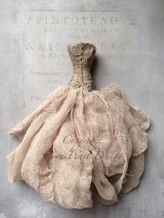 an old fashion dress hanging on the wall