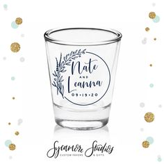 a shot glass with the words, mate and lanna printed on it next to gold confetti