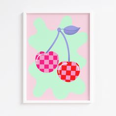 two cherries on a pink and purple background