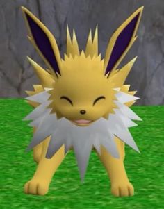 a yellow and white furry animal standing on top of a green grass covered field with rocks in the background