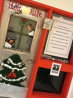 a door decorated with christmas decorations and pictures