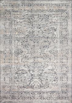 an antique style rug in grey and beige tones