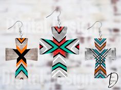 three colorful crosses are hanging from earrings