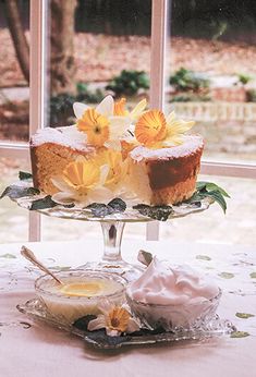 there is a cake on the table with flowers