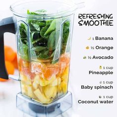 a blender filled with fruit and vegetables on top of a table