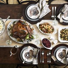 an overhead view of a thanksgiving dinner with turkey, stuffing and other foods on the table