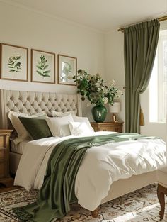 a bedroom with a large bed and green drapes on the windowsill, along with two vases filled with flowers