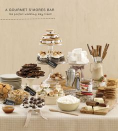 a table topped with lots of food and desserts