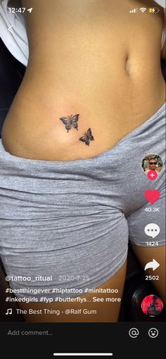 a woman's stomach with two small butterflies on her belly and the words, i love