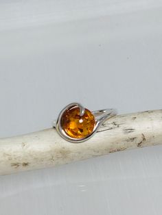 Statement small silver ring, decorated with genuine Baltic amber's the center piece in the design.Absolutely stunning everyday amber jewelry. Material : Natural Baltic Amber with sterling Silver Color : Green ,Honey ,Yellow Dimensions  :  10 mm Color green size  :   7  US Color honey  size ;  8   US Color yellow size  :  7 1/2  ,  US Finish   :  Polished All our product handcrafted. All product sent by us securely packaged. Amber Open Ring For Anniversary, Silver Baltic Amber Rings As Gift, Amber Open Ring For Promise, Amber Hallmarked Promise Ring, Baltic Amber Ring For Anniversary, Sterling Silver Amber Birthstone Rings, Orange Sterling Silver Ring, Sterling Silver Amber Ring, Stone Ring Women