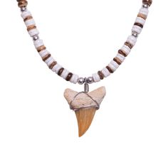 PRICES MAY VARY. Length: 18 Inches - the length of an item is measured from end to end, including the clasp. To measure your neck size, use a flexible tape measure or cord and wrap it around the base of your neck. Add 2 inches to the measurement for a comfortable fit. Material: 5mm Tiger Brown Coconut Shell & Shell Beads. The necklace is made of genuine coconut and shells that are drilled, smoothed and polished. Durable, lightweight, and easy to care for. They can be cleaned with mild soap and w Shark Pendant, Shell Beads Necklace, Shark Tooth Necklace, Shark Tooth, Shark Teeth, Coconut Shell, Shell Beads, Shell Necklaces, Beads Necklace