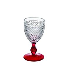 a red wine glass sitting on top of a table