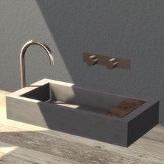 a bathroom sink sitting next to a faucet on top of a wooden floor