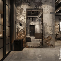 an empty room with exposed brick walls and doors