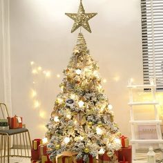 a decorated christmas tree with presents under it