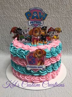 a birthday cake with paw patrol characters on it