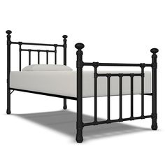 a black metal bed frame with white sheets