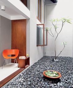 the interior of a modern house with stone flooring