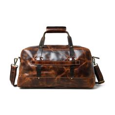 Here is the perfect blend of sophistication and style with our unique leather duffle bag in a rich, textured saddle tan, accented by sleek black handles. The full-grain buffalo leather adds to the endurance yes well as the charm of the duffle bag. Best for short trips and routine journeys. Elevate your travel game with this distinctive accessory today! Salient Features Made of full-grain premium buffalo leather Pure brass hardware with bottom studs to protect the bag Adjustable leather shoulder Everyday Satchel Travel Bag In Textured Leather, Classic Textured Leather Duffle Bag For Everyday, Leather Duffle Bag With Double Handle For Everyday, Brown Everyday Travel Bag With Top Handle, Classic Textured Leather Rectangular Weekender Bag, Classic Textured Leather Duffle Bag, Everyday Brown Top Handle Travel Bag, Classic Rectangular Textured Leather Weekender Bag, Classic Textured Leather Travel Bag For Daily Use