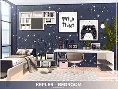 a computer desk sitting next to a bed in a room with stars on the wall