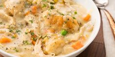 a white bowl filled with chicken and dumplings