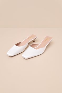 All of your special occasion styles will be absolute perfection once you pair them with the Lulus Auroette White Satin Kitten Heel Mule Pumps! These attention-worthy heels have a sleek satin fabrication that shapes a tapered-off, pointed-toe upper with a square-cut collar. An eye-catching, sculpted kitten heel complete the simple slide-on design. Available in whole sizes only. 1. 5" sculpted heel. Cushioned insole. Felted rubber sole has nonskid markings. Man made materials. Imported. Lulus | Au White Pointed Heels, White Almond Toe Kitten Heels, Formal White Closed Toe Kitten Heels, White Closed Toe Kitten Heels, Medium Width, Elegant White Kitten Heels With 4-inch Heel, White Leather Kitten Heels, Medium Width, Ivory Shoes, Pointed Heels, White Heels