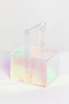 an acrylic box is sitting on a white surface