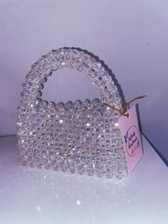 "100% handmade 🤍 Welcome to my store! Each bag is created with love and attention to detail, making them truly one-of-a-kind. Size: > width - 18 cm > height -  11 cm (20 cm with handle) The bags are strong enough to carry all your daily essentials, shiny enough to make your evenings sparkle, and with their unique designs, you can be sure to stand out from the crowd. Let's add a new one to your collection. 💞 Please feel free to contact me with any questions or special requests by pressing the \"Message seller\" button at the bottom of the page. Check out more of our unique designs:  https://www.etsy.com/shop/ValienteHandmadee" Trendy Evening Bag With Pearl Handle For Gift, Trendy Evening Bag With Pearl Handle As Gift, Crystal Embellished Evening Bag For Gift, Trendy Handmade Evening Bag For Gift, Trendy Beaded Evening Bag As Gift, Trendy Beaded Evening Bag Perfect As A Gift, Silver Beaded Clutch For Gift, Beaded Pouch Evening Bag For Gift, Beaded Pouch Evening Bag As Gift