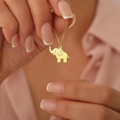 Welcome to my shop, All our produtcs handmade with love. The Elephant Necklace features a cute and meaningful elephant pendant, symbolizing luck, wisdom, and protection. This animal charm necklace is perfect for those who love spiritual jewelry with a touch of elegance. ♡ Materials: High Quality 925 Sterling Silver, Gold Plated Silver and Rose Gold Plated Silver ♡ All necklaces will be carefully packaged and sent in a special gift box. I hope you can find your personalized necklace that suits you in our store. For other samples, please visit our store. ♡ HOW TO ORDER ♡ 1- Choose Color and Option  2- Choose necklace length. Standard 16" and for Kids 12"  3- If there is any other information you want to specify, please message us. 4- Click "Add to cart" or " Buy it now" Thanks ♡ PROCESSING A Gold Animal Design Necklace For Gift, Gold Necklace With Animal Design For Gift, Gold Elephant Pendant, Elephant Necklace Gold, Love Spiritual, Lucky Charm Necklace, Animal Necklace, Gold Elephant, Elephant Necklace