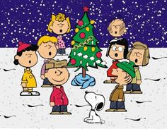 a group of cartoon characters standing around a christmas tree in the snow with peanuts on it